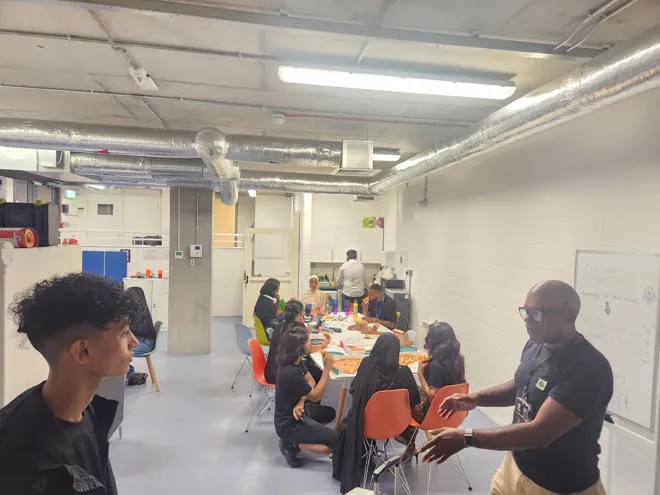 youth worker and young people doing activities