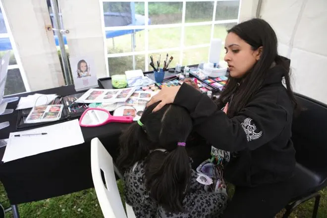 Youth worker doing some face painting at one of our events.