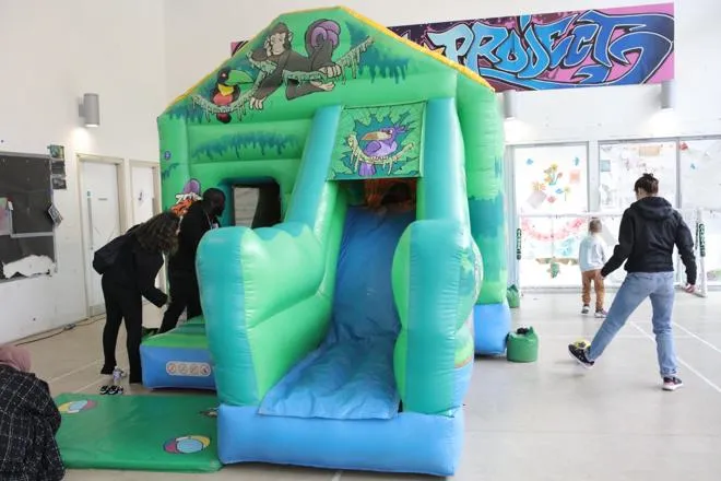 young kids on a bouncy castle
