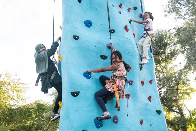 Young people enjoying the Climbing Wall