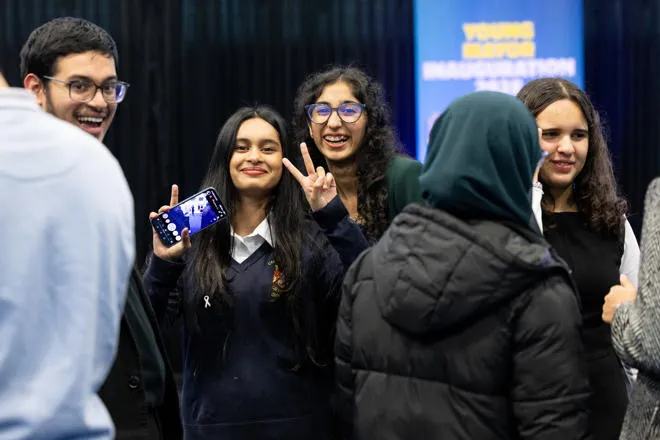 Young person doing a peace sign