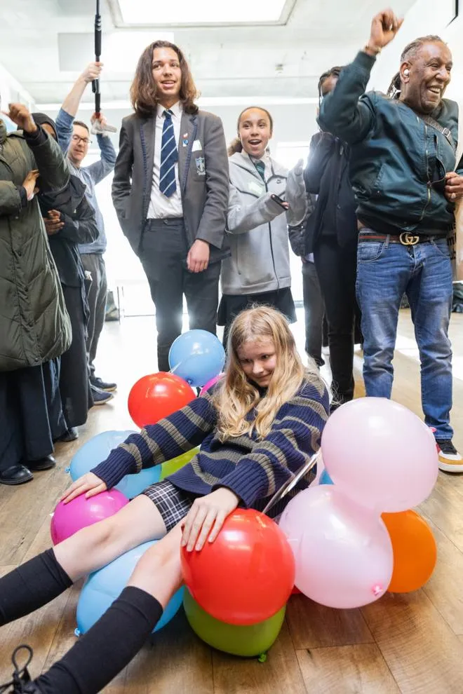 People playing with balloons