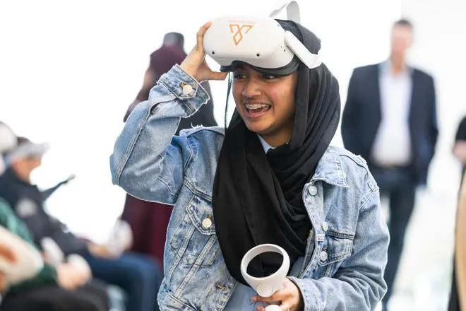 Young person playing with a VR headset