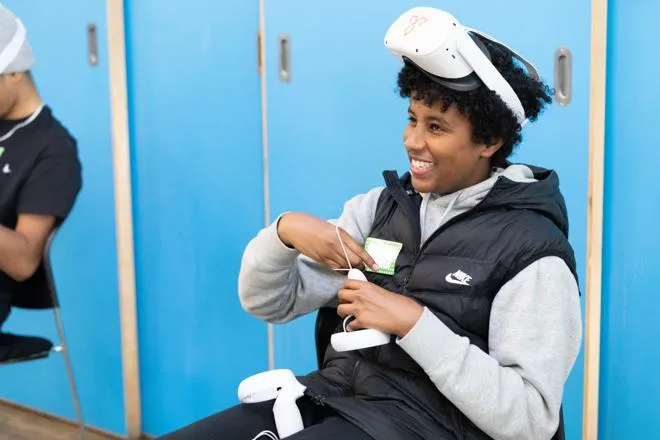 Young person playing with a VR headset