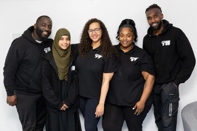 A group of youth workers smiling.