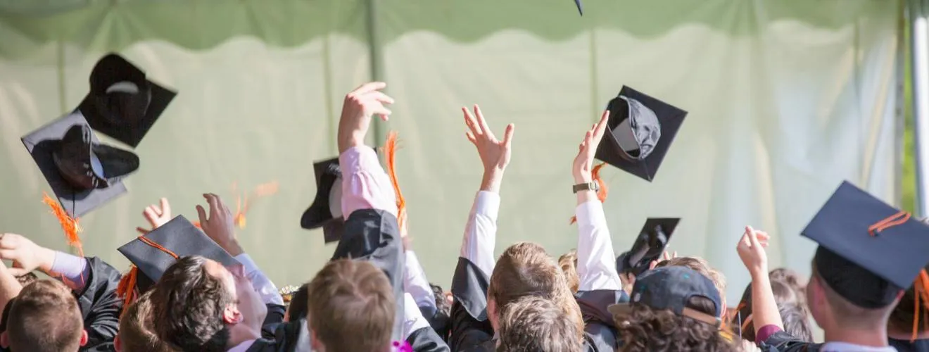 Graduates celebrating at graduation
