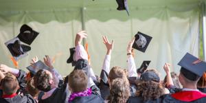 Graduates celebrating at graduation