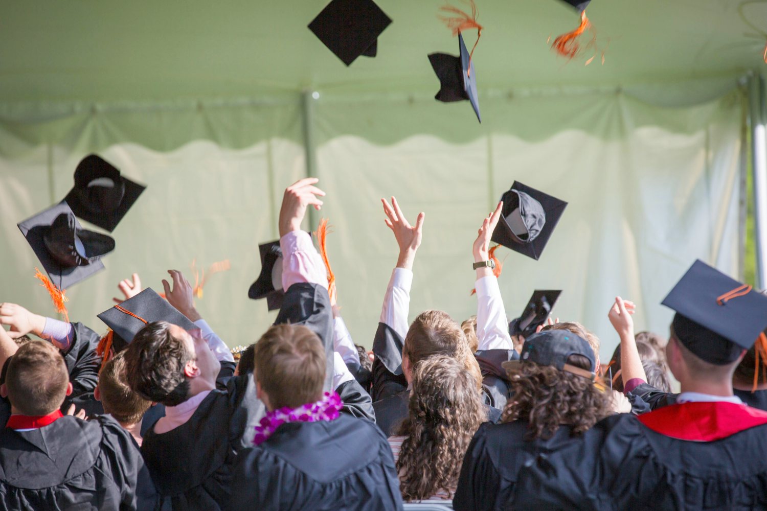 Graduates celebrating at graduation