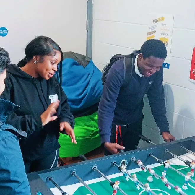 Youth Worker and Young Person playing Table Football