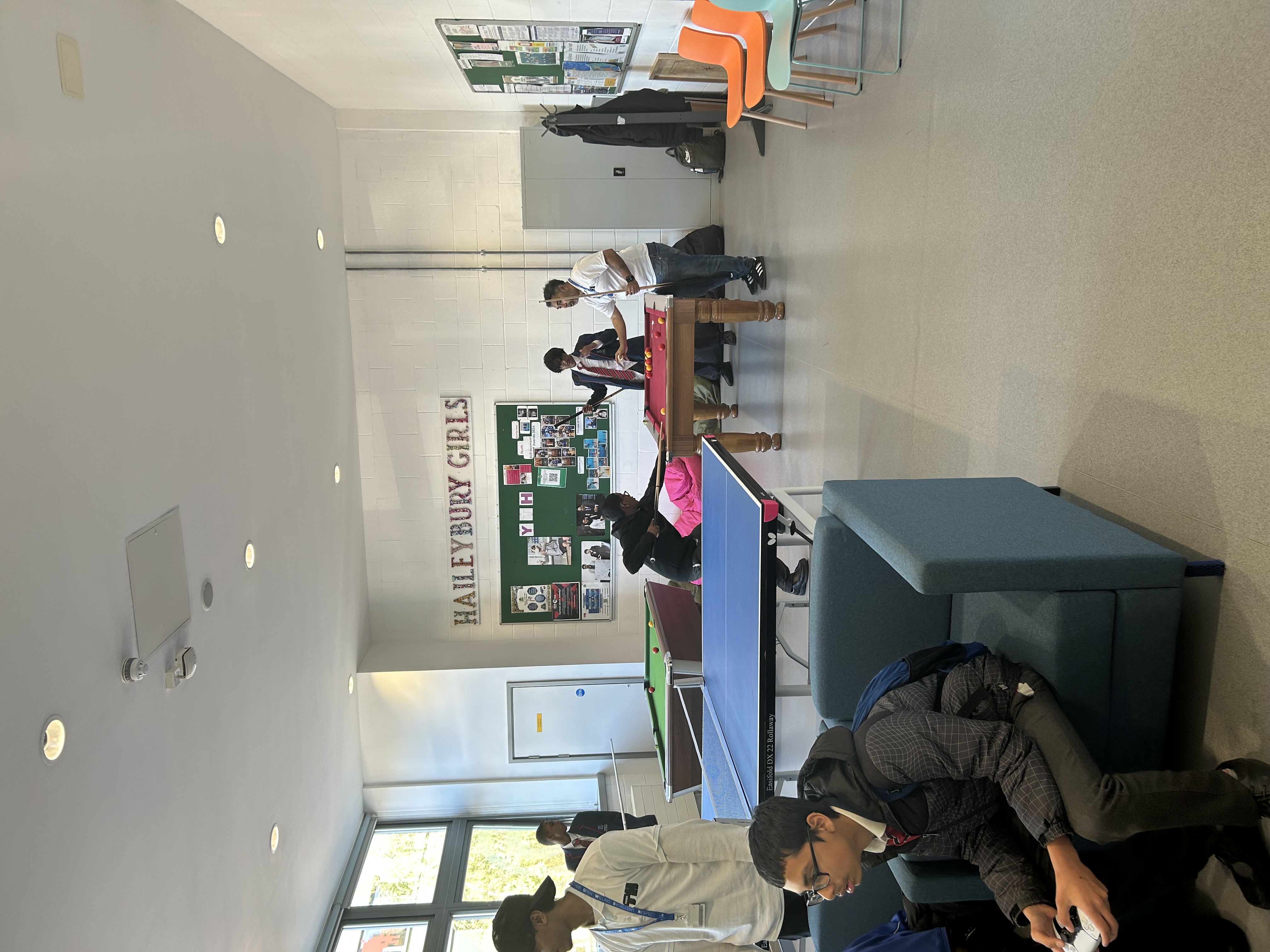 Young people trying out pool for the first time!!!