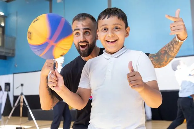 Young Person and Youth Worker doing Basketball Tricks & Skills