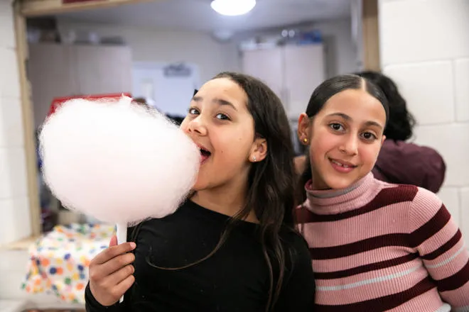 Girls eating candy floss