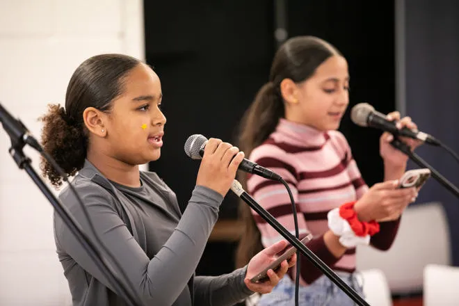 two people singing