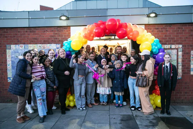 Young people and politicians gathered outside a youth centre