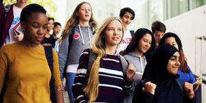 Group of teenagers walking down stairs