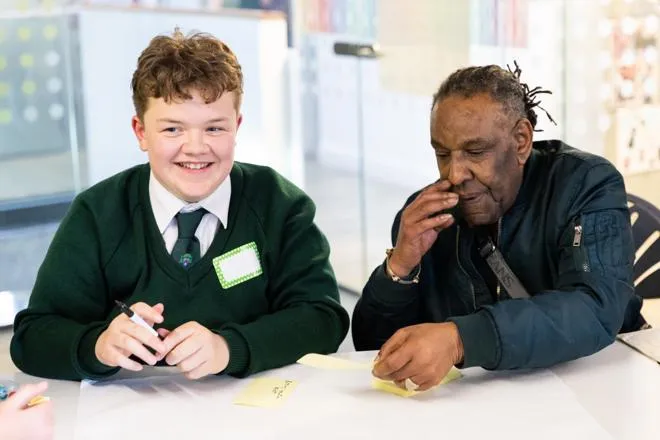 student working with youth worker