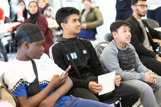 young people attending a talk