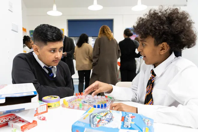 Young People playing table top board games
