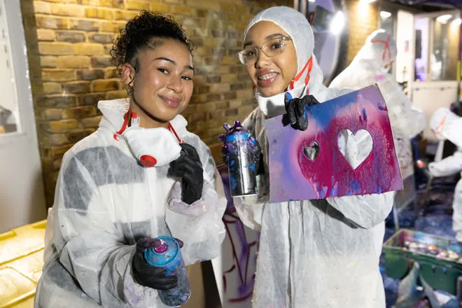 Young people doing graffiti